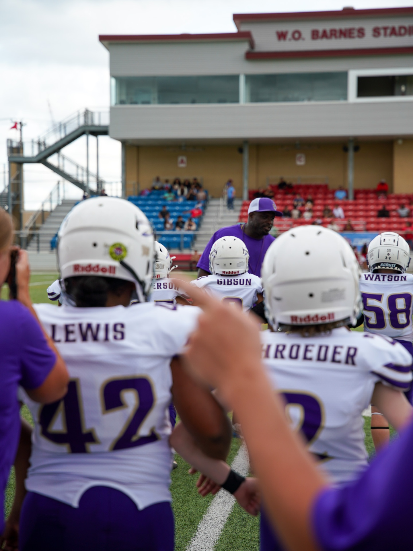 Pre-game huddle — W.O. Barnes Stadium